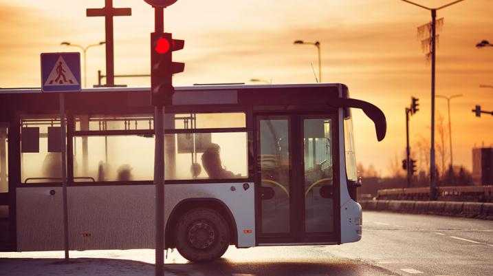 Invigorating Lagging Bus and Walking Networks Could Pay Dividends for the City - bus in a red light