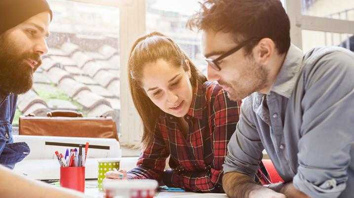 How to Retain a Millennial Workforce - employees working together