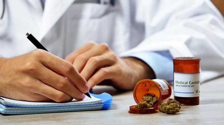 A Grandmother's Story: How Amendment 2 Could Change Lives - Doctor writing on his book.