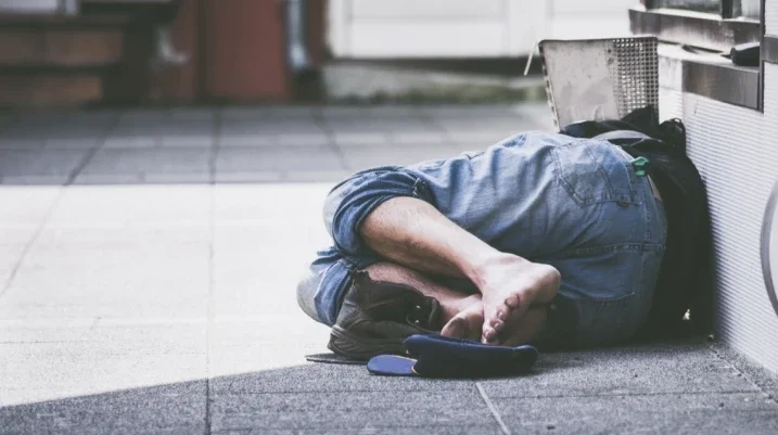 Homeless person on floor