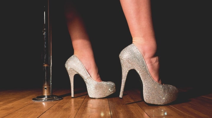 Dancer heels near pole