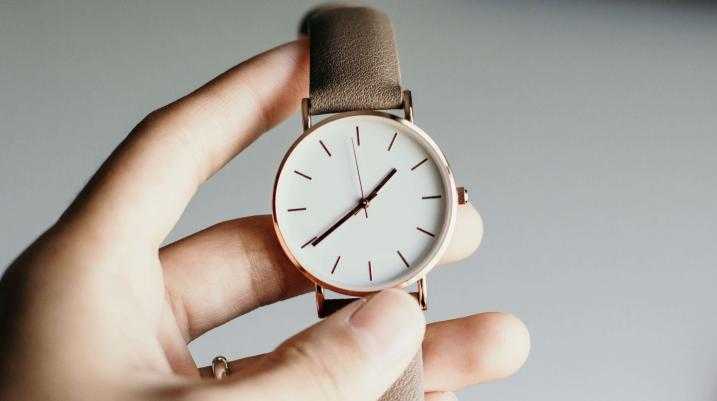 Person Holing watch
