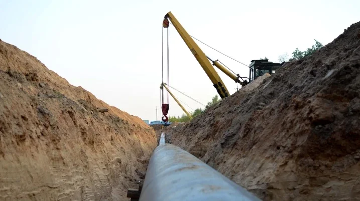 Iron Pipe crane in background