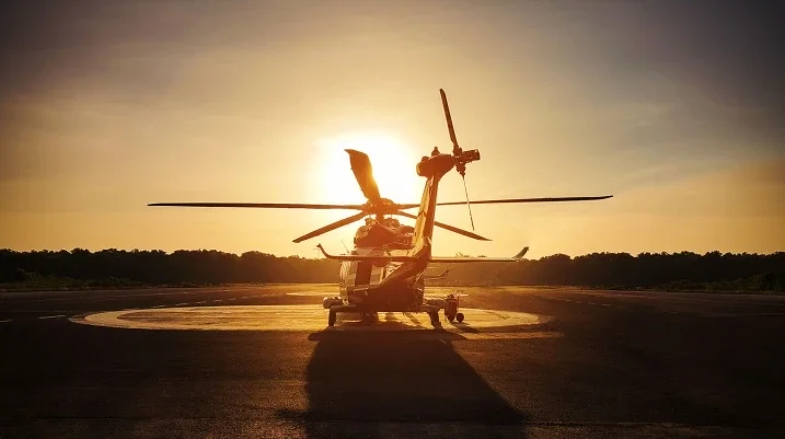Helicopter against sunset