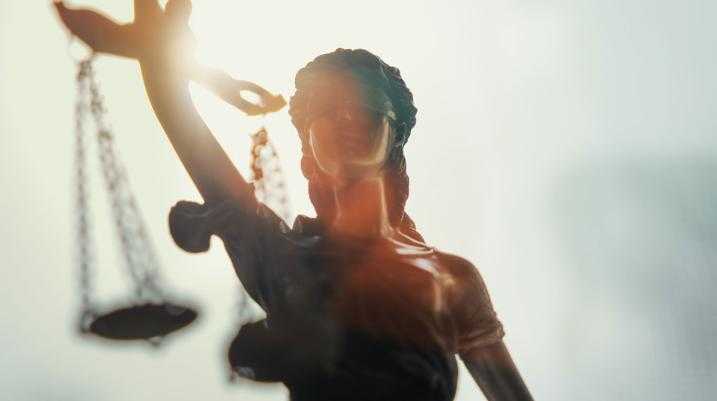 statue with scales of justice