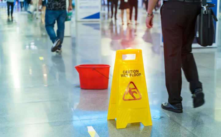 What to Do If I Fall in a Grocery Store - slippery floor sign