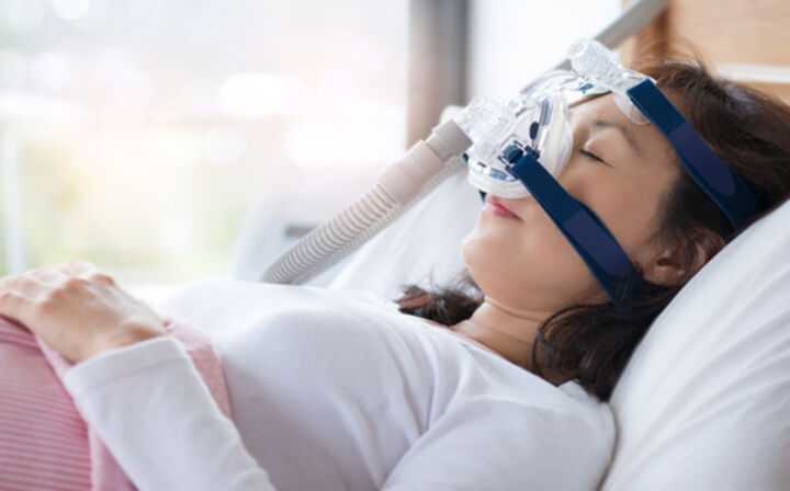 What Should I Do With the CPAP Recall - lady sleeping with a cpap machine