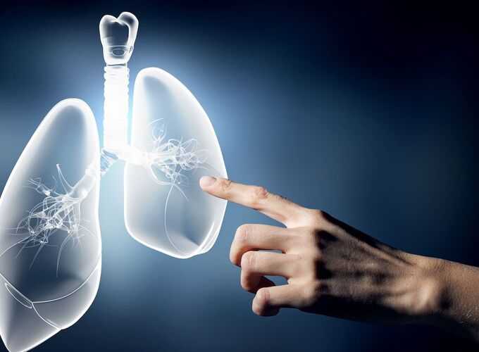 Man pointing at lungs