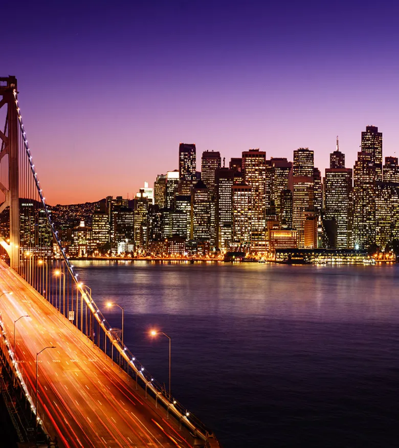 Bridge and city at dusk