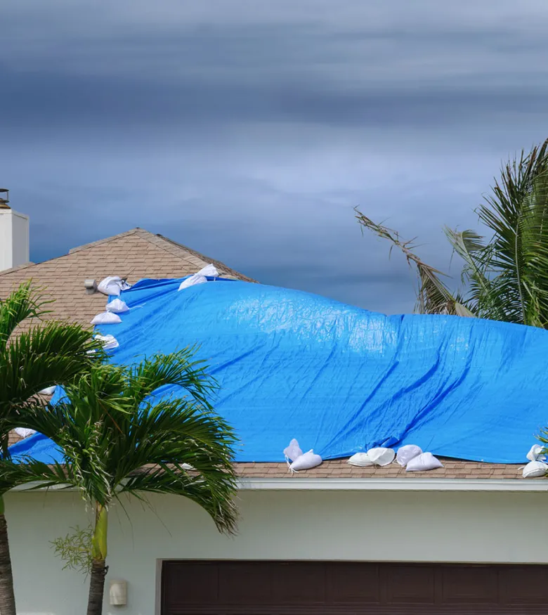 Hurricane Insurance Claim Attorneys in Houston, TX - Covered Roof during hurricane