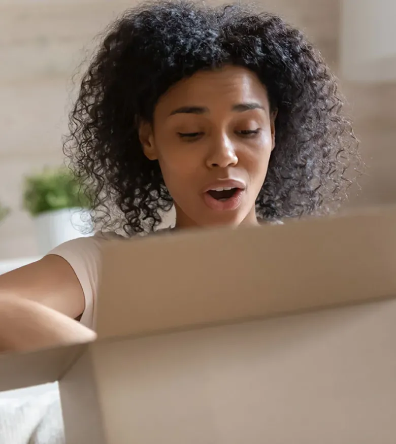 Naples Product Liability Lawsuits - woman opening box in shock