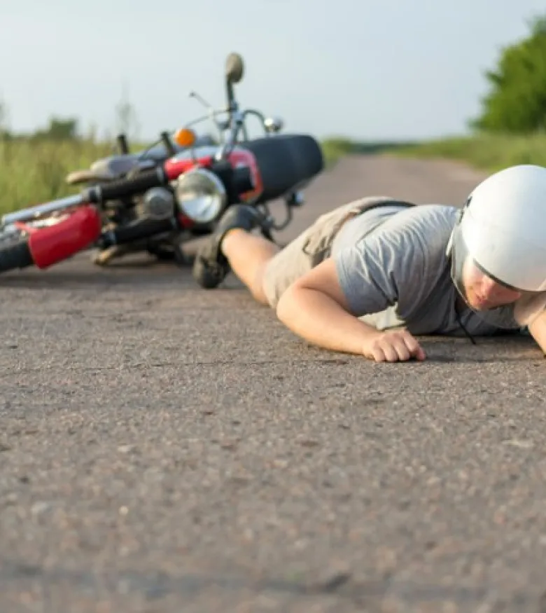 Motorcycle Accident Lawyers in Owensboro, KY - Bike rider on floor after accident