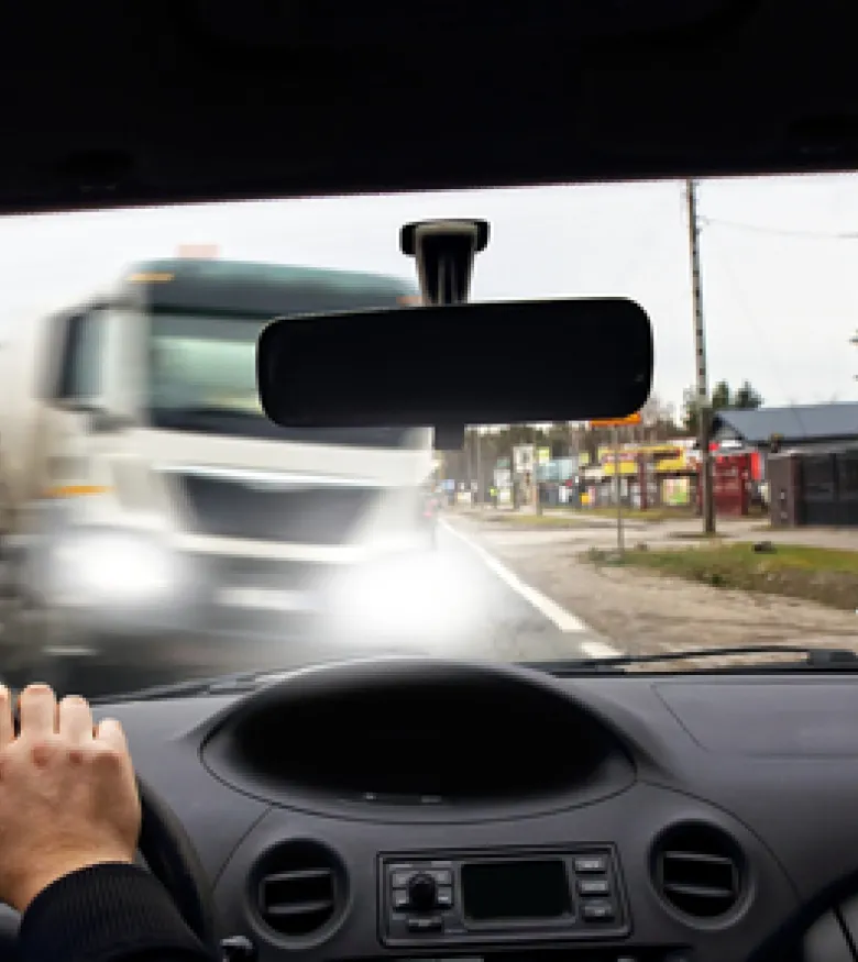 Dashcam view of a near truck collision, seek a truck accident attorney in Bedford.