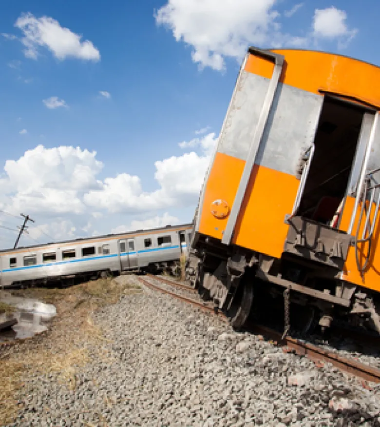 A derailed train with damaged cars, emphasizing the need for a Train Accident Attorney in Queens to provide legal assistance.