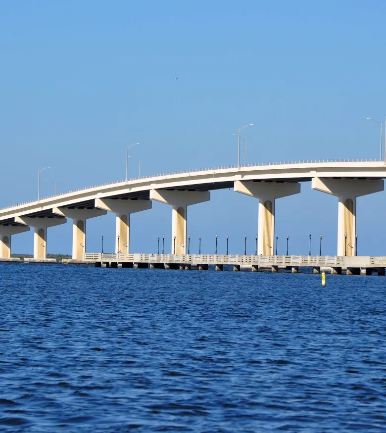Waterfront with long bridge