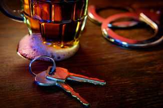 Car keys, beer and handcuffs