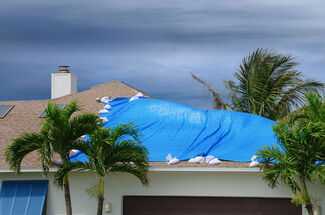 Hurricane Insurance Claim Attorneys in Houston, TX - Covered Roof during hurricane