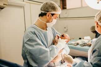 Birth Injury Lawyers in Alpharetta, GA - doctor holding baby with birth injury
