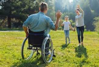 Social Security Disability Lawyers in Pittsburgh, PA - man in wheelchair playing with his family