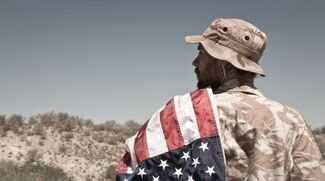 Where Can I Find the Best Veterans Disability Lawyers in St. Louis - veteran holding the american flag