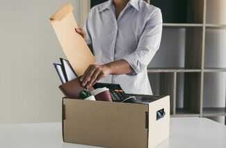 Find Wrongful Termination Attorneys in Philadelphia - Woman packing items at work