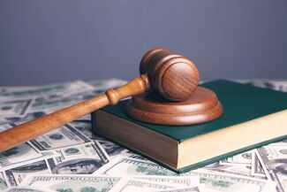 Is It Necessary to See a Doctor After a Car Accident in Fort Myers - judges book with money