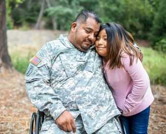 Where Can I Find Veterans Benefits Lawyers in Big Pine Key, Florida - Veteran soldier hugging his daughter