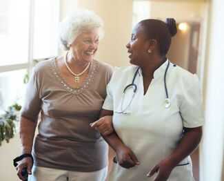 Nursing Home Abuse Attorneys in Deland, FL - Elderly woman and Nursing Home Caretaker