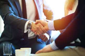 Tallahassee Commercial and Business Litigation Attorneys - lawyers shaking hands
