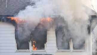 Burn Injury Lawyers in Naples, FL - building with a fire