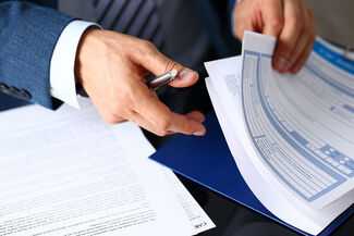Atlanta Insurance Lawyers - lawyer with folder with papers