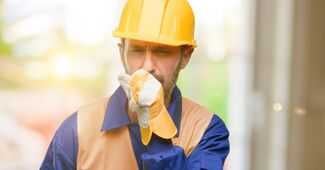 St. Augustine Mesothelioma Lawyers - construction worker coughing from asbestos
