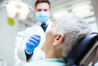 Tampa Dental Malpractice Lawyers - Dentist working on patient