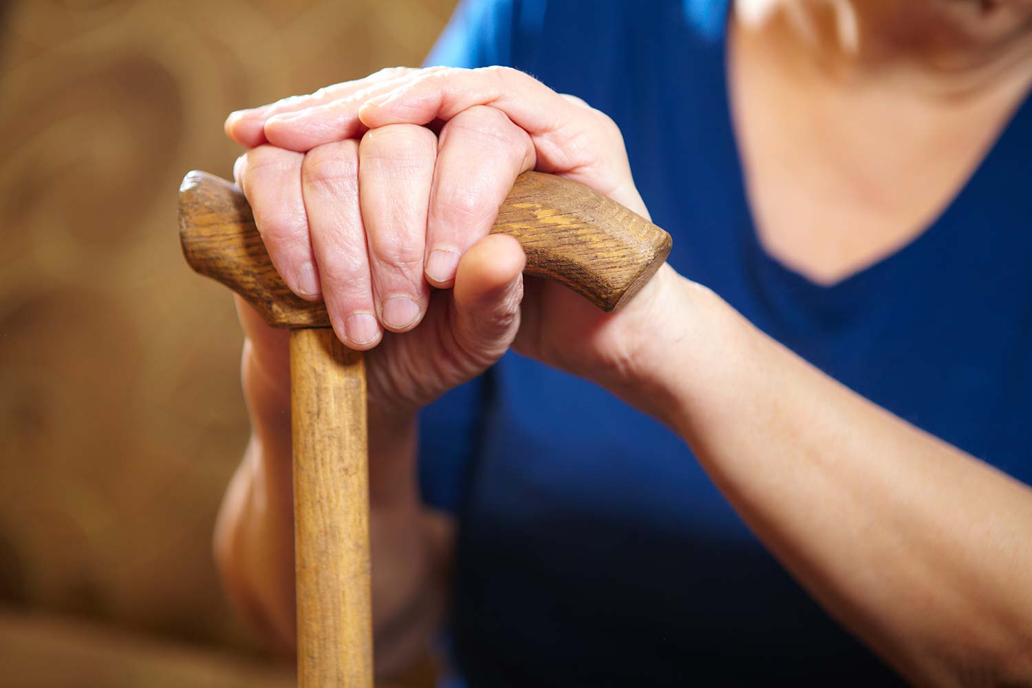Elderly woman with cane