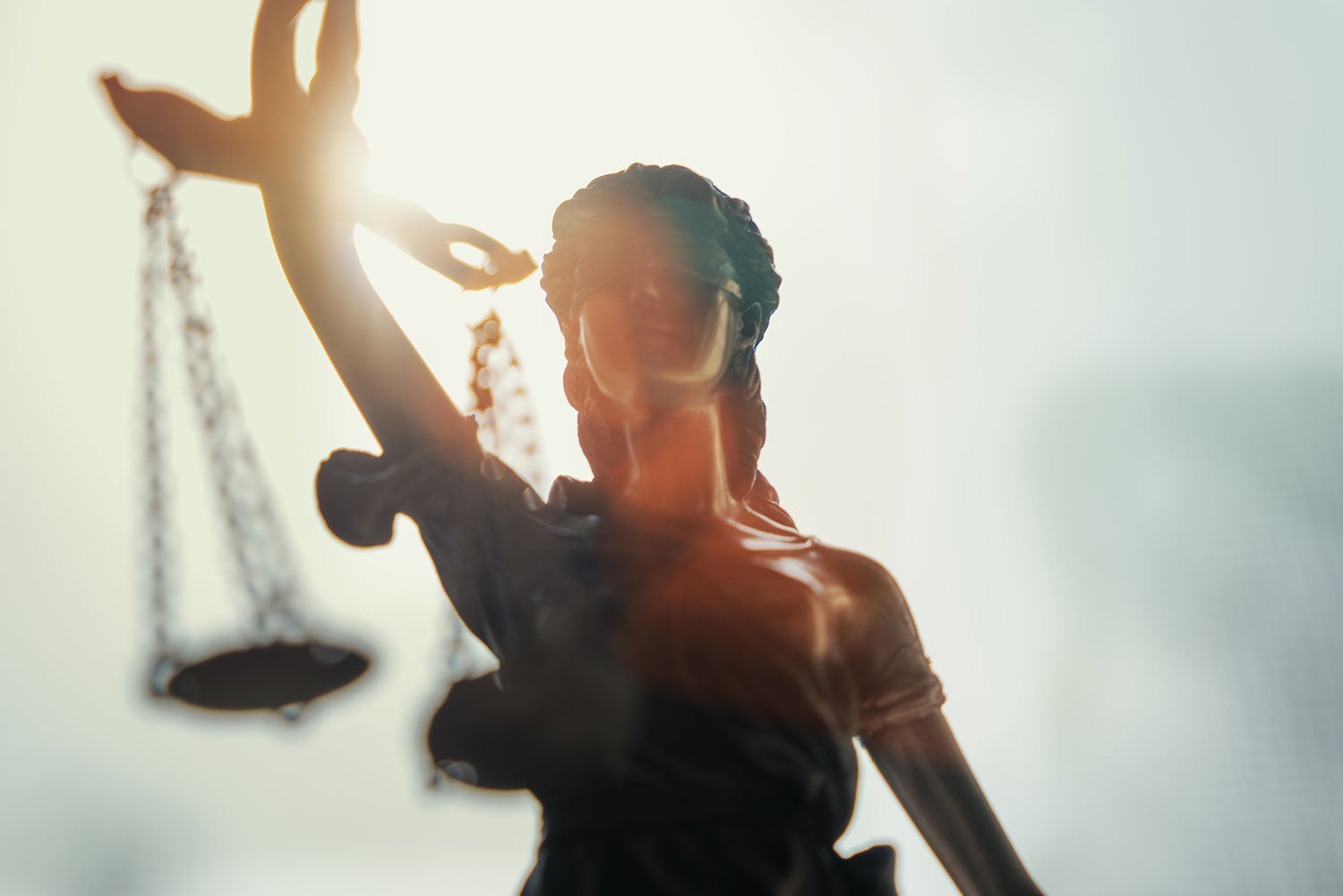 statue with scales of justice