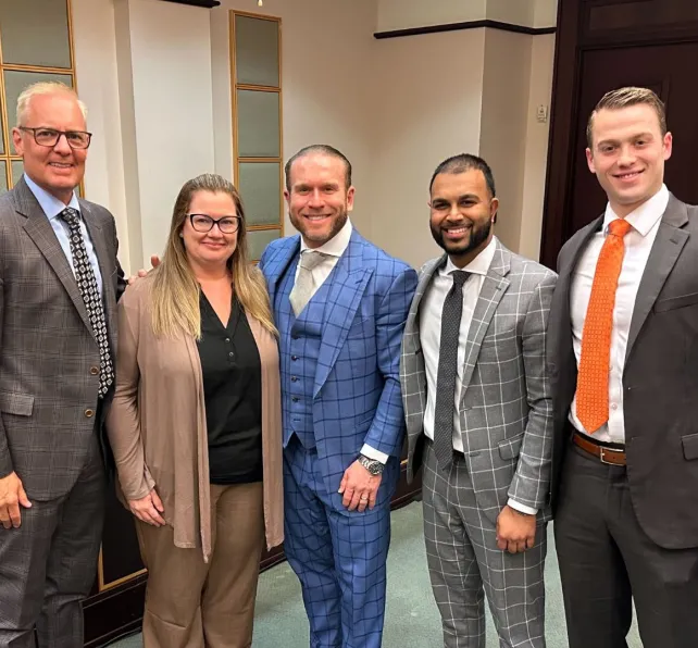 morgan and morgan attorneys with client at trial